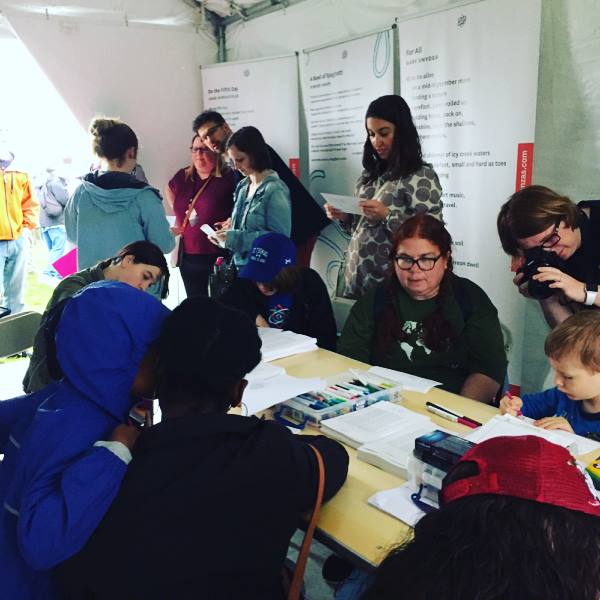 Many people stopped by our tent to learn how to write science-themed poetry.